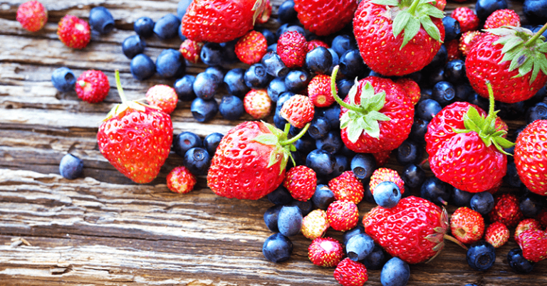 superfood berries blueberry strawberry on wood