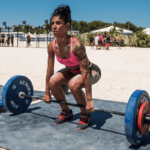 crossfit girl emom workouts outside beach