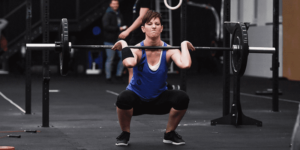 athlete perfects her weightlifting skills with clean workouts Beginner Ab Exercises
