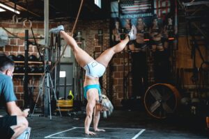 dani speegle performs gymnastics abs workouts with handstand hold