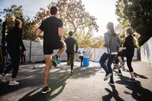group of people performs quick workouts