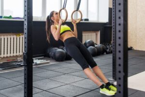 Fitness beginner performs easy exercise ring rows 3 Day Beginner Gym Routine