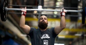 Protein for athlete with barbell
