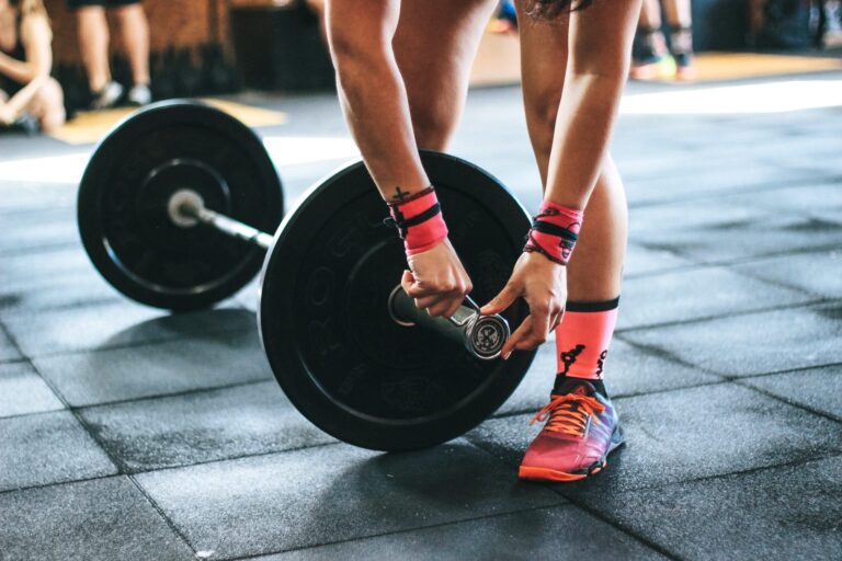 athlete sets up barbell for pendlay row