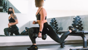 athlete performs Bulgarian split squat with dumbbell How to Get Bigger Legs