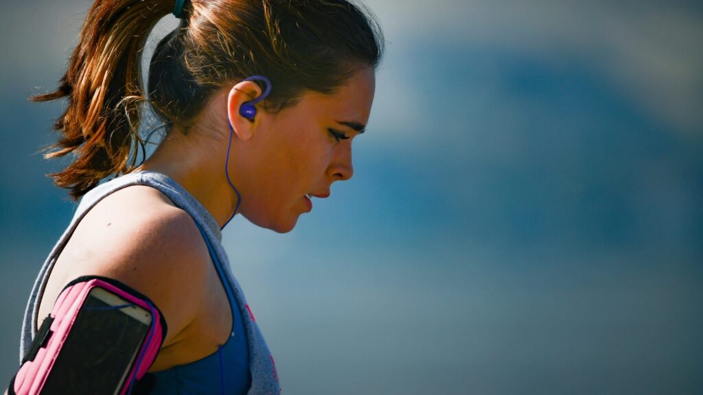 woman enjoys the benefits of exercise for managing negative mental health symptoms after run