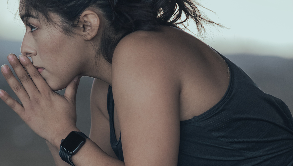 athlete with wrist heart rate monitor