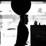 Man-Lifting-Weight-in-Garage-Gym