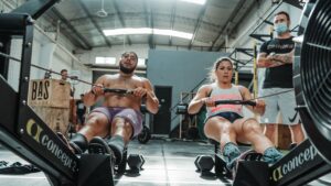 team athletes working out on rower Low Carb Meals
