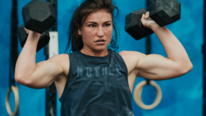athlete trains hard with dumbbells