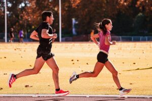 two track athletes run fast