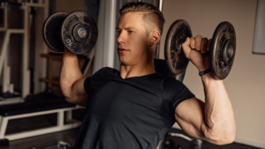 middle aged man dumbbell shoulder training