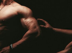 Arms on black background
