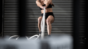 HYROX athlete doing sled pulls How to Watch HYROX London Regionals